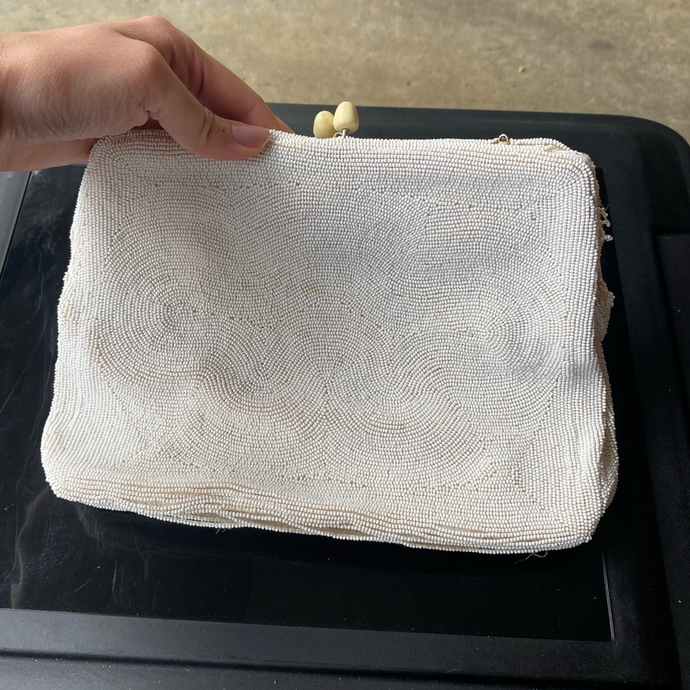 Elegant White Clutch with Textured Surface and Wristlet